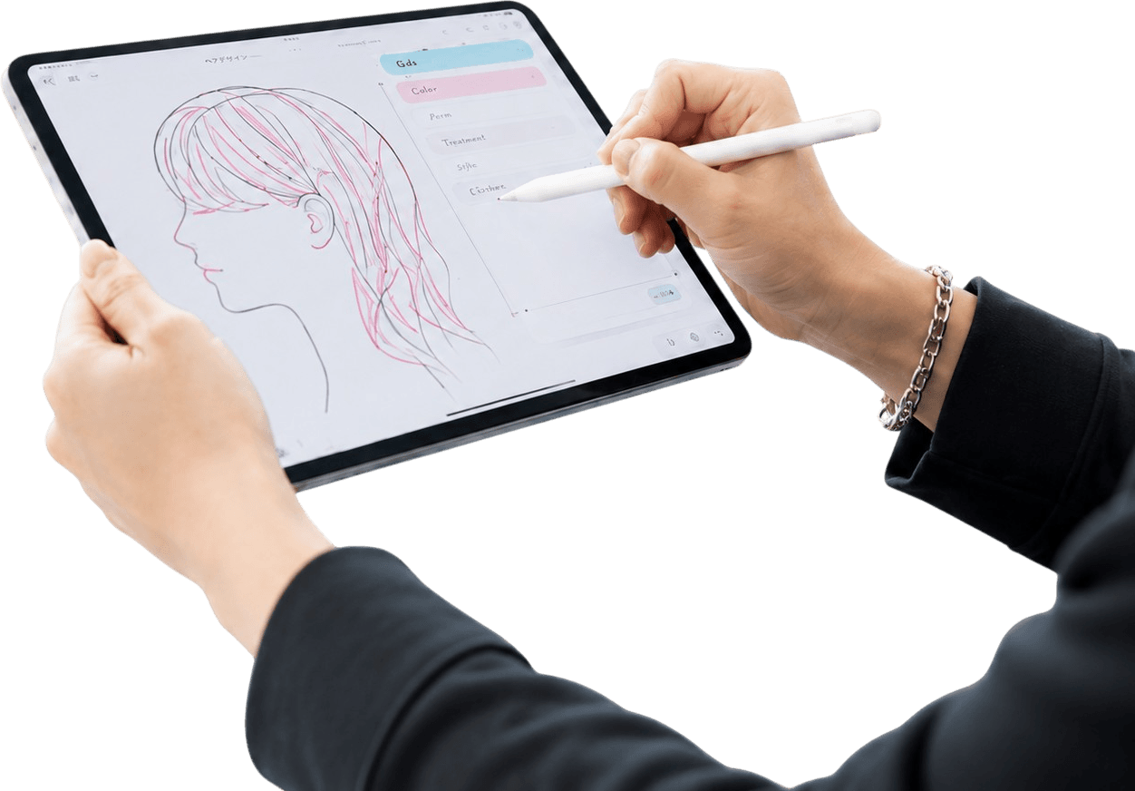 タブレットでカルテの展開図を描く手元